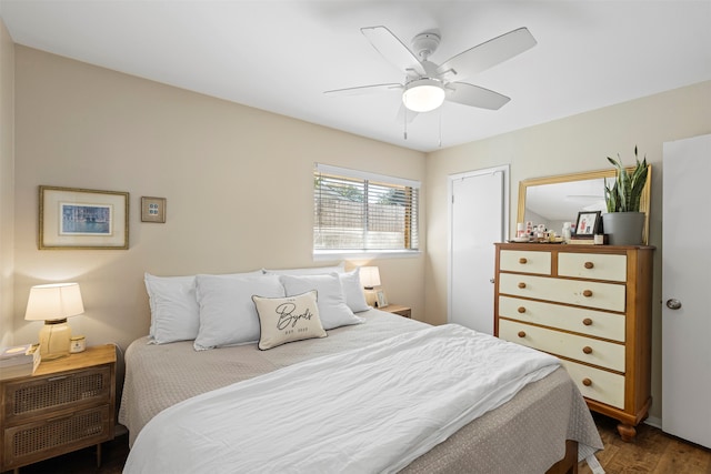 bedroom with dark wood-type flooring and ceiling fan