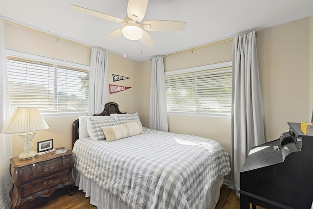 bedroom with dark wood-type flooring and ceiling fan