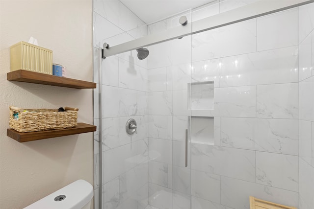 bathroom with walk in shower and toilet