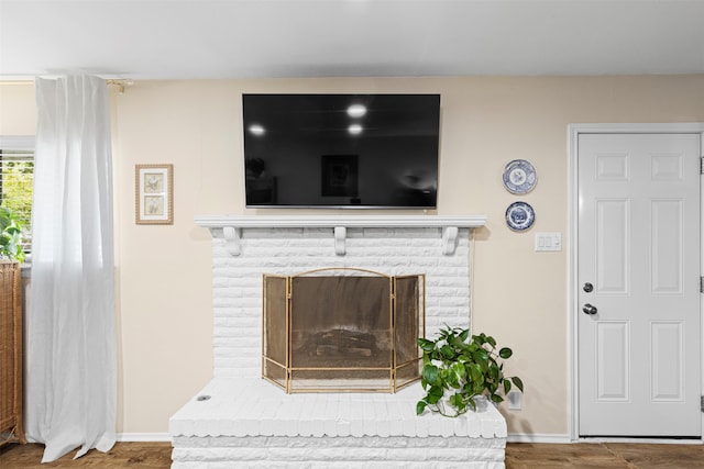 interior details featuring a fireplace and hardwood / wood-style floors