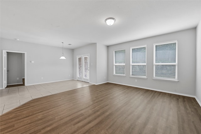 unfurnished living room with light hardwood / wood-style flooring