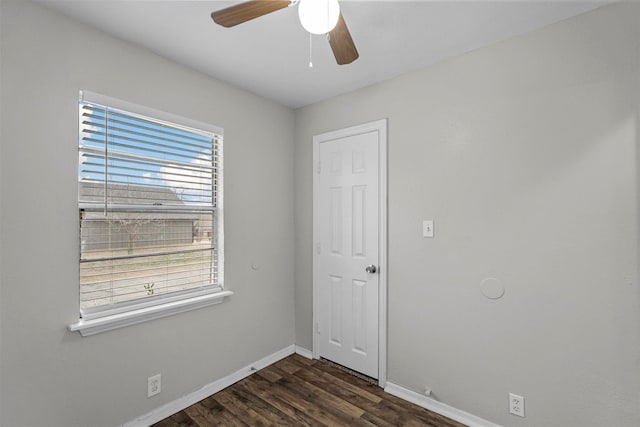 unfurnished room featuring ceiling fan and dark hardwood / wood-style floors