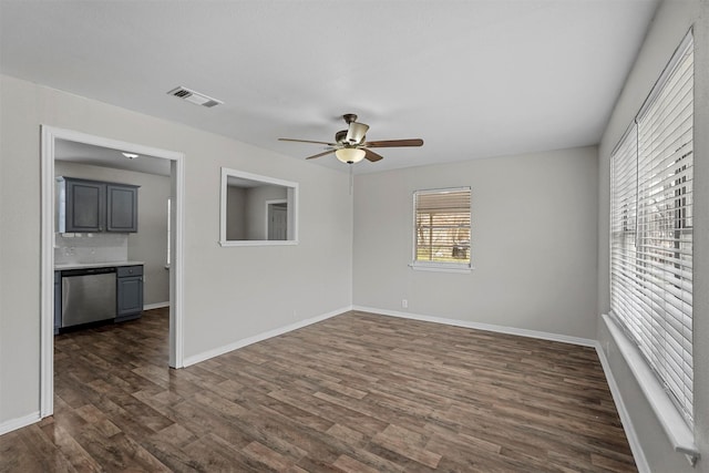 empty room featuring dark hardwood / wood-style floors and ceiling fan