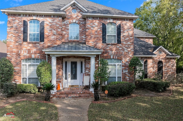 view of front of home with a front lawn