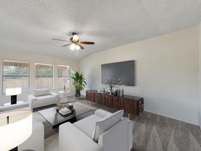 living room featuring ceiling fan, a textured ceiling, vaulted ceiling, and carpet floors