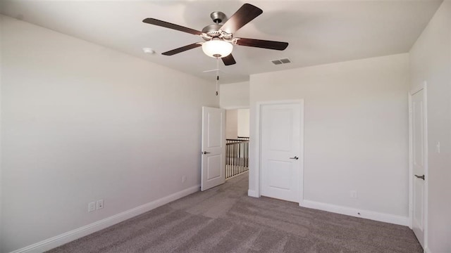 unfurnished bedroom with ceiling fan and carpet