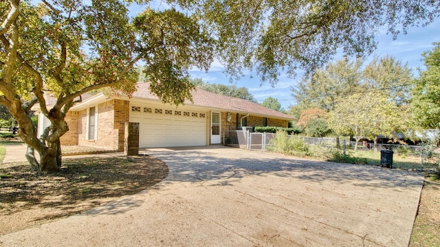 ranch-style home featuring a garage