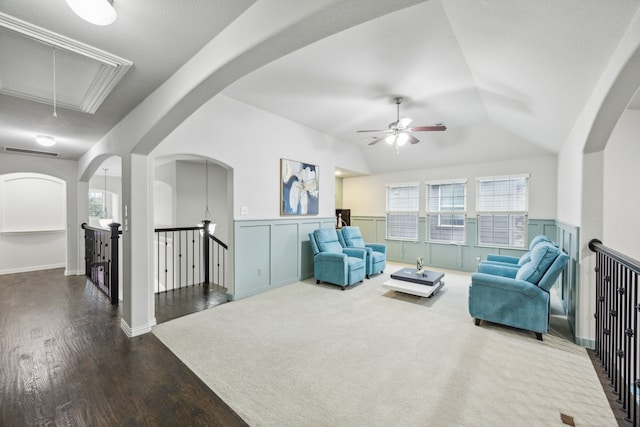 living area featuring ceiling fan, wood-type flooring, and lofted ceiling