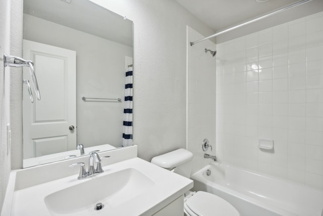 full bathroom featuring vanity, shower / bath combo, and toilet