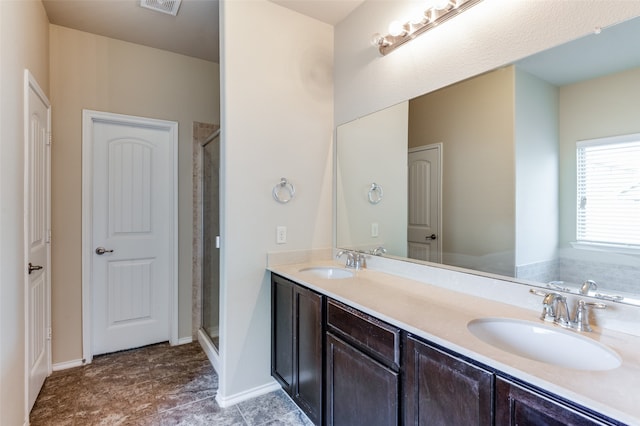 bathroom with shower with separate bathtub and vanity