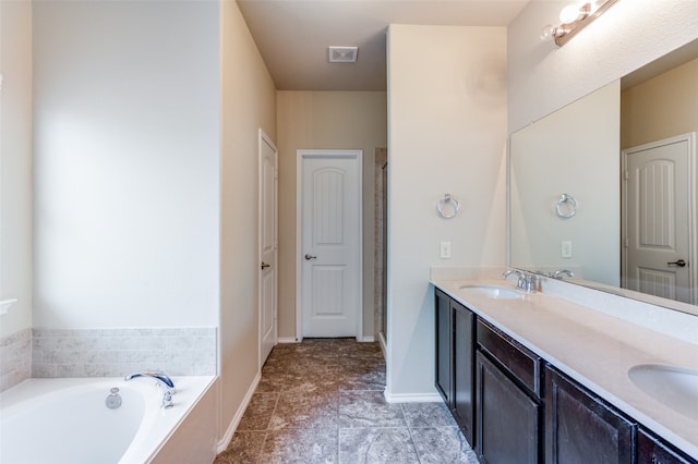 bathroom with vanity and shower with separate bathtub