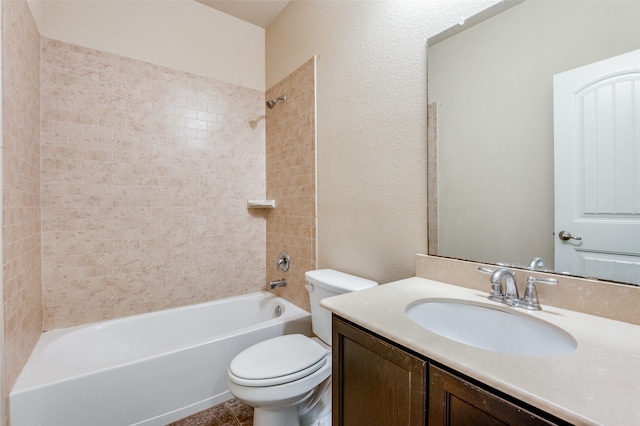 full bathroom featuring toilet, tiled shower / bath combo, and vanity