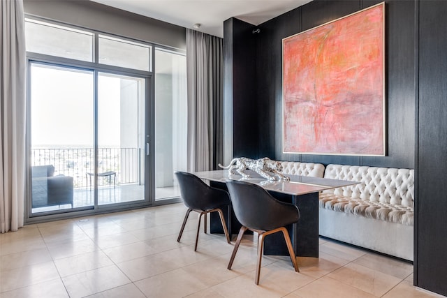 dining area with light tile patterned floors