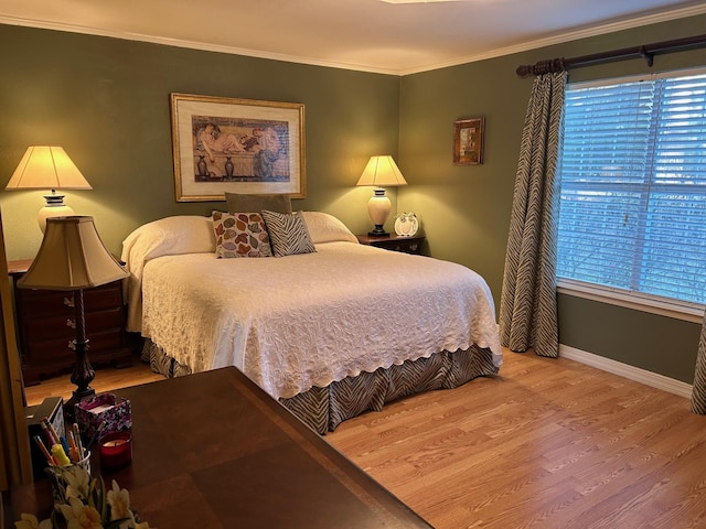 bedroom featuring crown molding and hardwood / wood-style floors