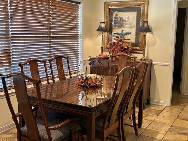 dining area with light tile patterned floors