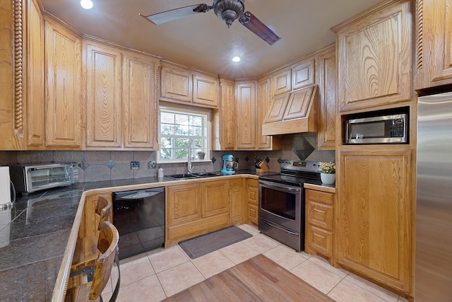 kitchen with light tile patterned flooring, sink, appliances with stainless steel finishes, light brown cabinets, and custom range hood