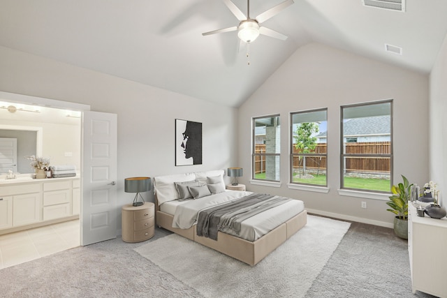 carpeted bedroom featuring high vaulted ceiling, ensuite bath, ceiling fan, and sink