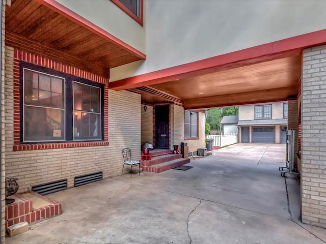 view of patio featuring a garage