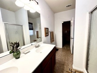 bathroom with vanity and an enclosed shower