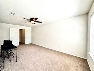 carpeted empty room with ceiling fan