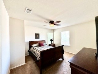 bedroom with ceiling fan and dark colored carpet