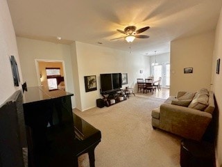 living room featuring ceiling fan and carpet floors