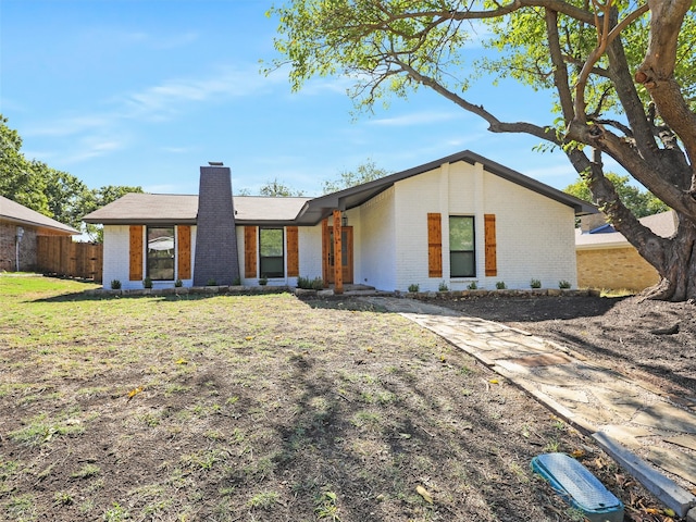 ranch-style home with a front yard