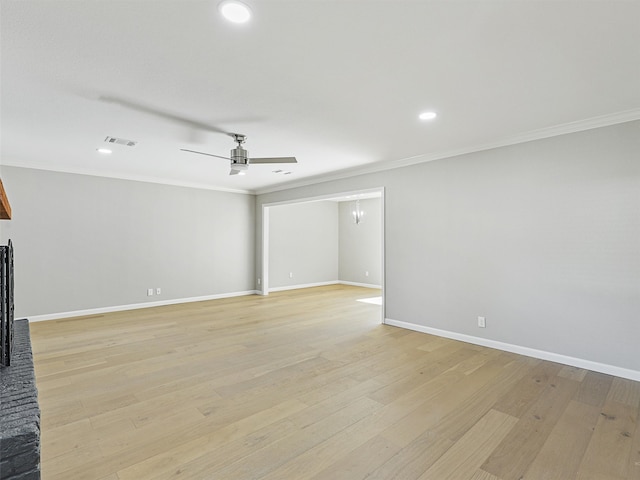 unfurnished living room featuring light hardwood / wood-style floors and ornamental molding