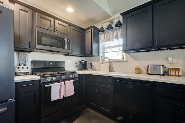 kitchen with black appliances and sink