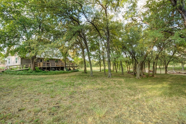 view of yard with a wooden deck