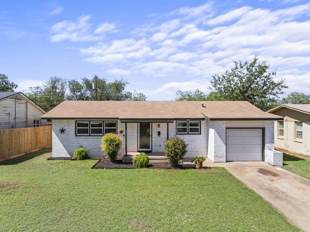 single story home featuring a garage and a front lawn