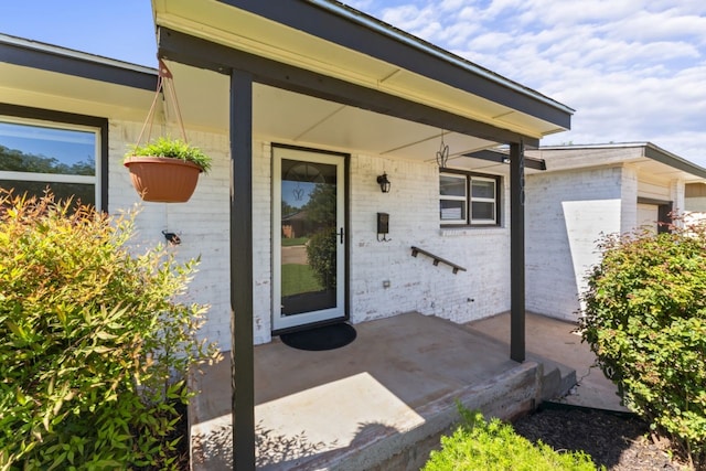 doorway to property featuring a patio