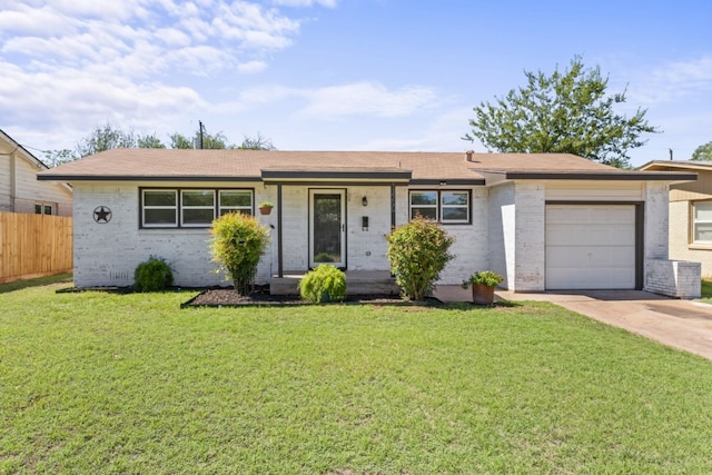 ranch-style home featuring a garage and a front lawn