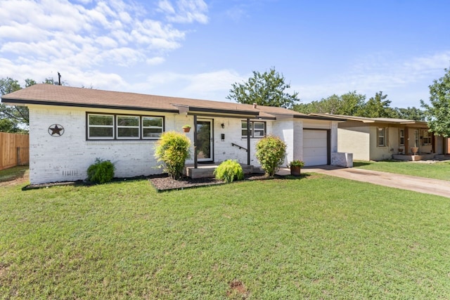 single story home with a garage and a front yard