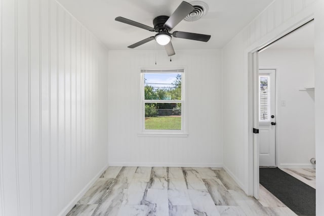 unfurnished room featuring ceiling fan