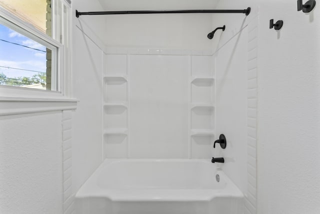 bathroom featuring washtub / shower combination