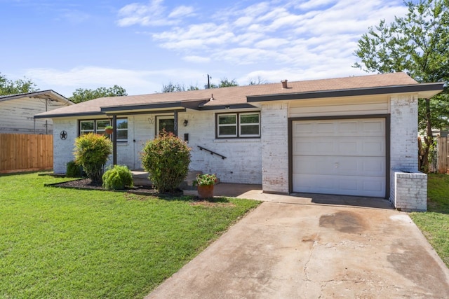 ranch-style house with a garage and a front lawn