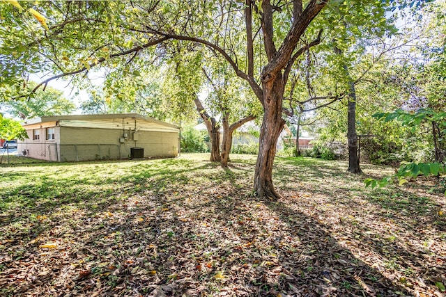 view of yard with central AC unit