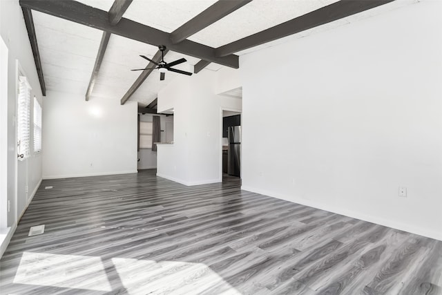 unfurnished living room with hardwood / wood-style floors, beamed ceiling, and ceiling fan