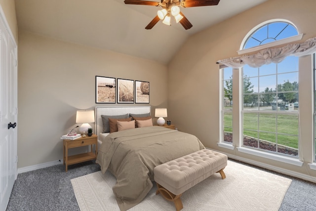 bedroom with carpet, lofted ceiling, multiple windows, and ceiling fan