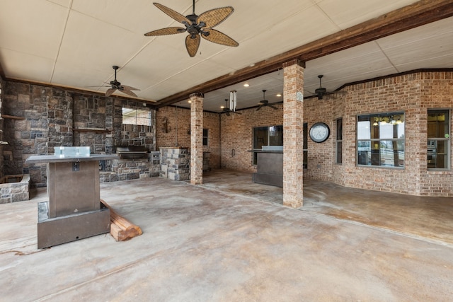 view of patio with ceiling fan and exterior kitchen