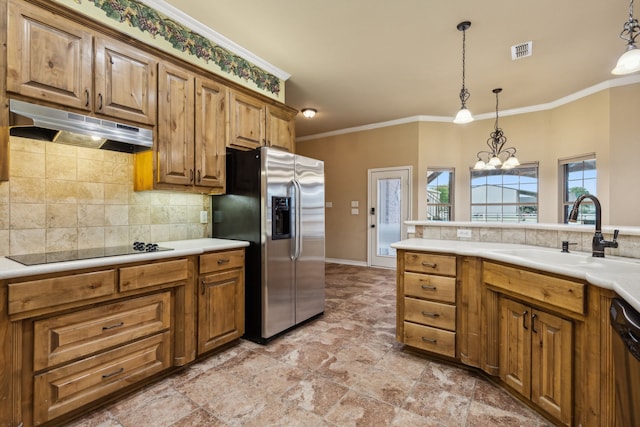 kitchen featuring sink, appliances with stainless steel finishes, backsplash, hanging light fixtures, and crown molding