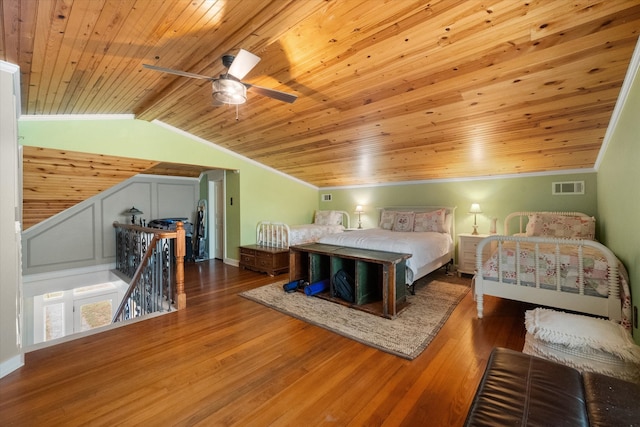 bedroom featuring wooden ceiling, crown molding, vaulted ceiling with beams, ceiling fan, and wood-type flooring