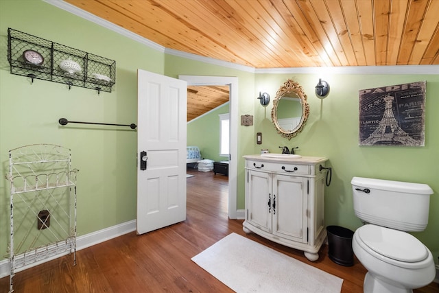 bathroom with lofted ceiling, toilet, hardwood / wood-style flooring, wood ceiling, and ornamental molding