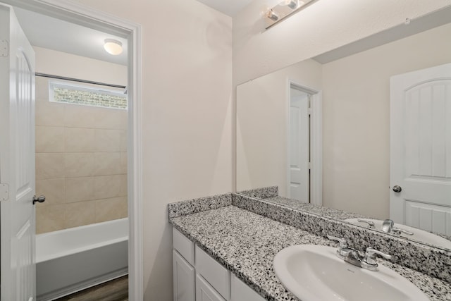 bathroom featuring hardwood / wood-style flooring and vanity