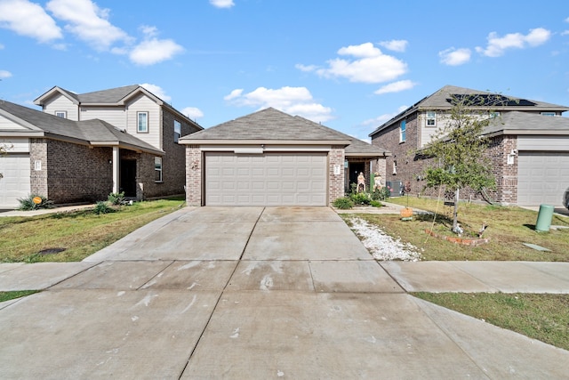 view of front of property featuring a garage and a front lawn