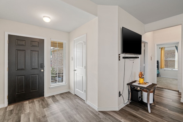 foyer entrance with light wood-type flooring