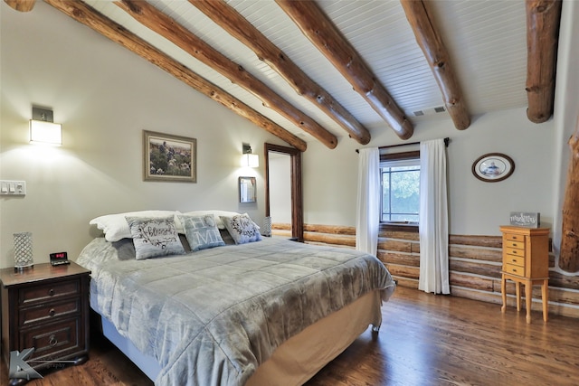 bedroom featuring dark hardwood / wood-style flooring and vaulted ceiling with beams