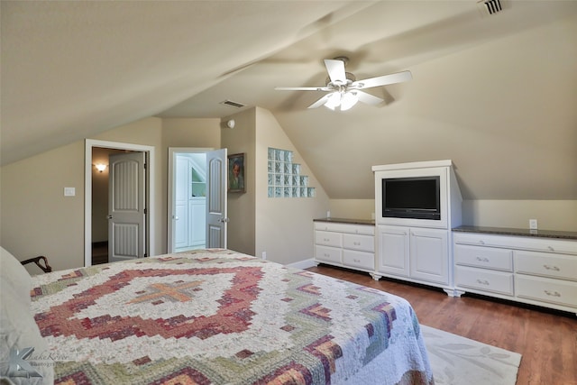 bedroom with lofted ceiling, ceiling fan, and dark hardwood / wood-style flooring