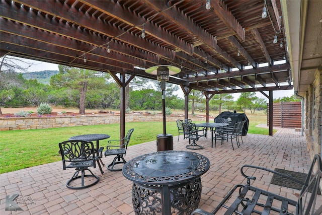 view of patio / terrace featuring area for grilling, a mountain view, and a pergola